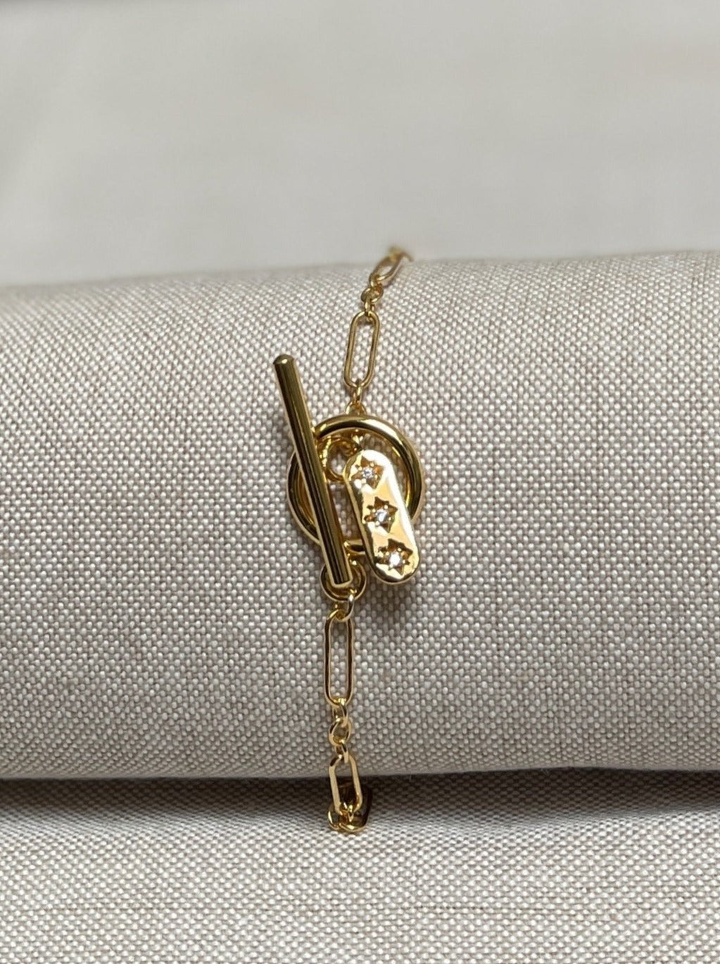 Image of bracelet with toggle clasp and charm.
