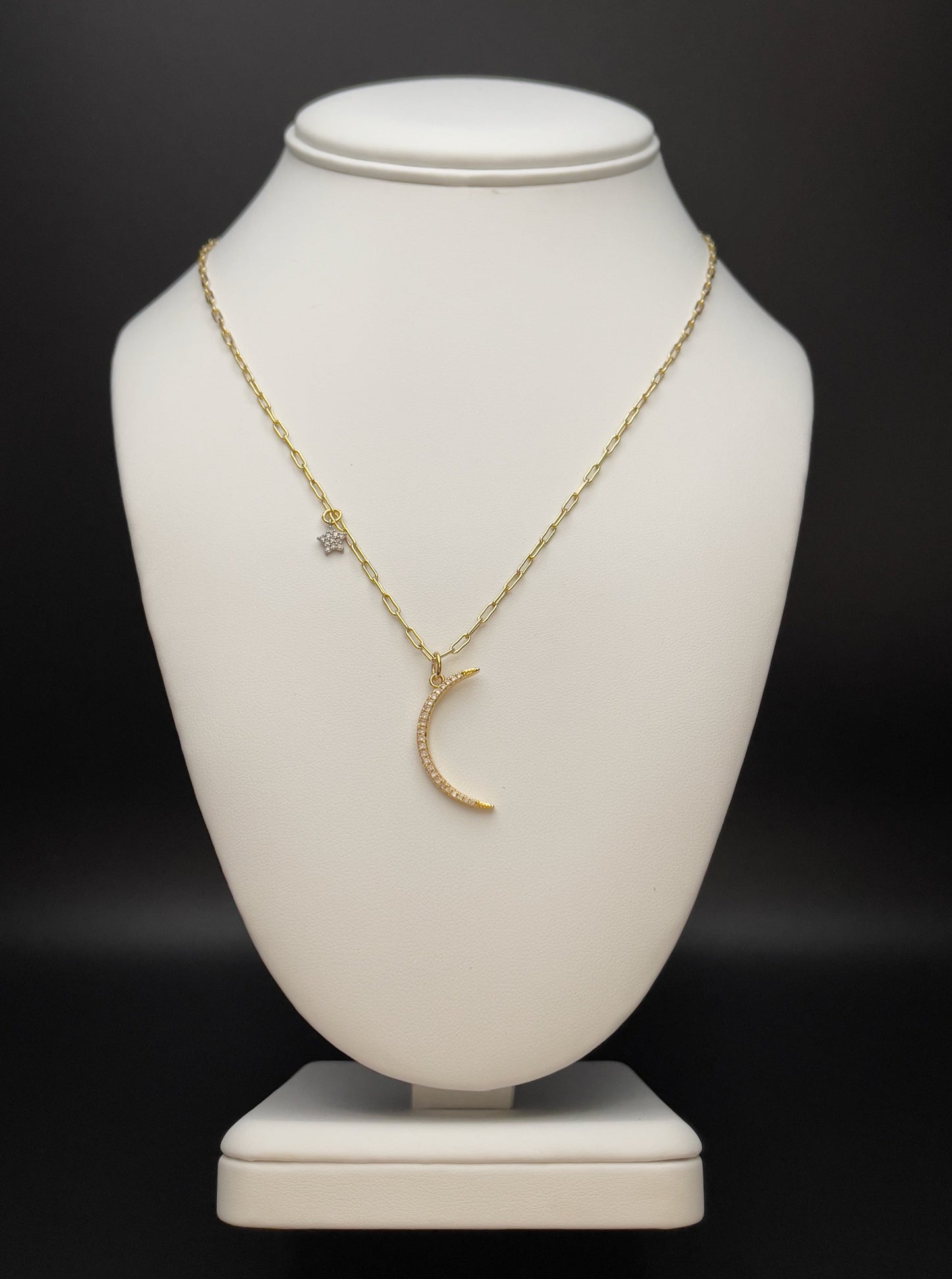 Image of necklace with moon and mini-star charm.