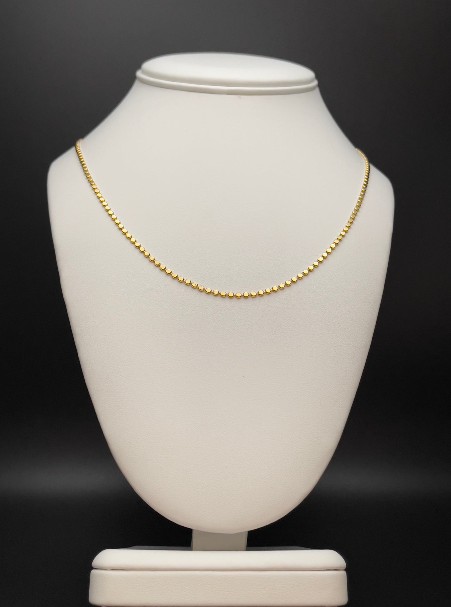 Image of necklace. Chain Length: 18 inches Chain Type: flat bead Chain Thickness: 2 mm Clasp: Lobster Chain: 18k Gold-filled