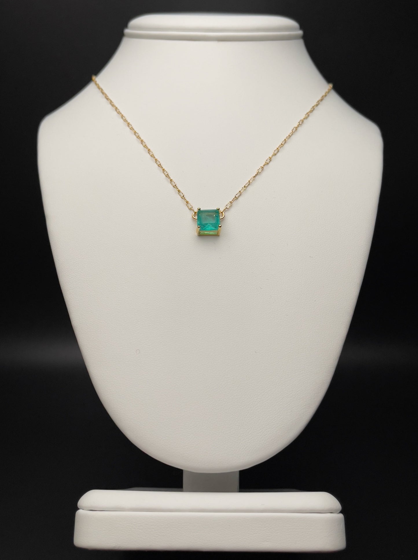 Image of necklace with square green cubic zirconia charm.