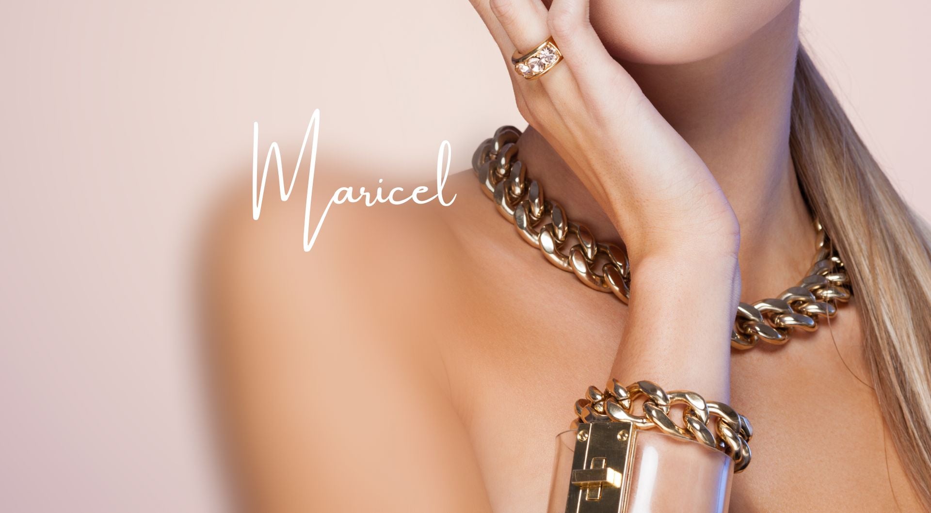 Decorative image of woman wearing bold gold jewelry.