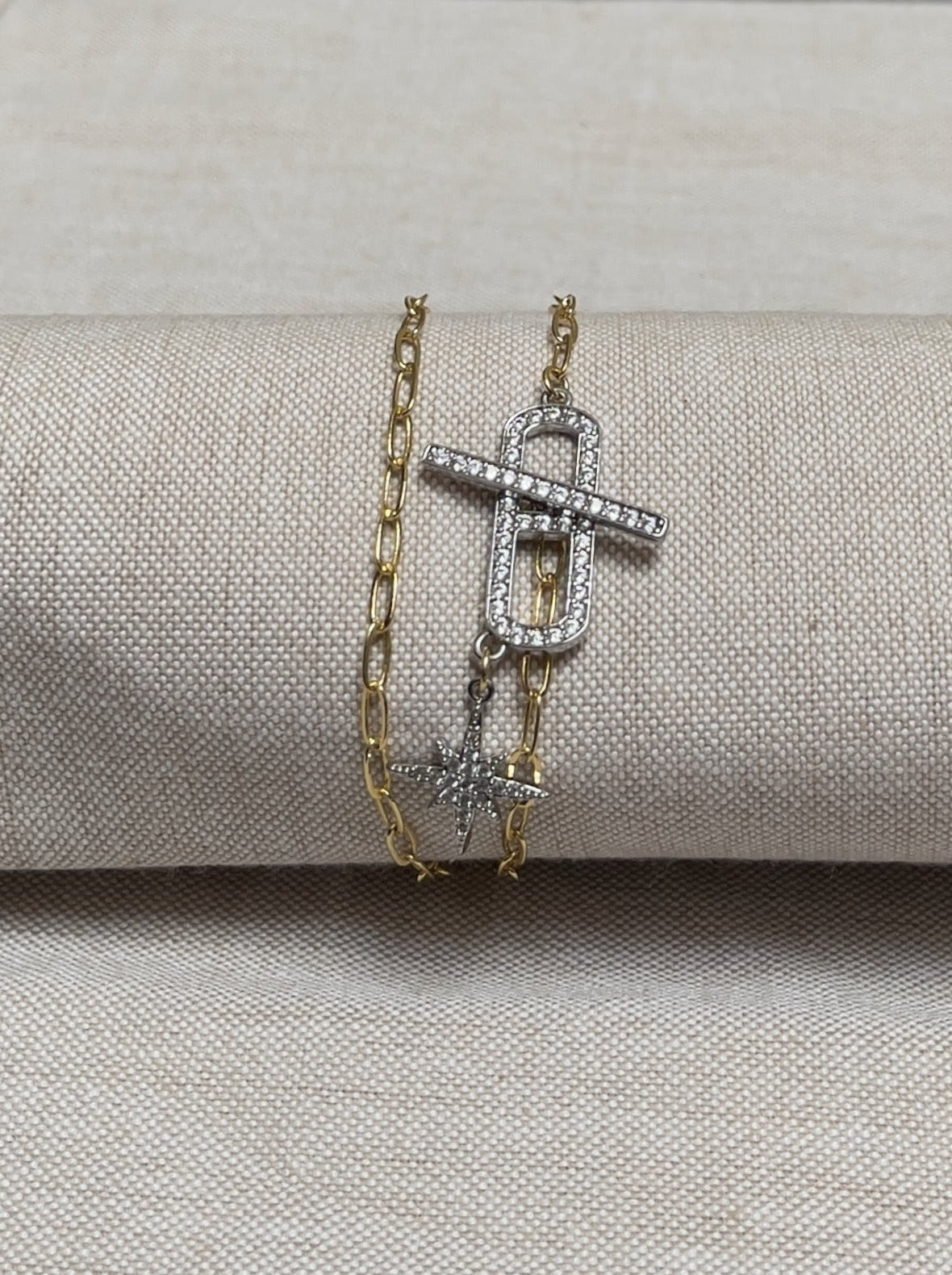Image of bracelet. Bracelet chain wraps around twice. Bracelet length can be customized. Chain Type:Elongated Oval Chain Thickness: 3 X 6 mm Clasp: 30 X 5 mm Charm: 17 X 15 mm Chain:14k Gold-filled Clasp: Rhodium -plated CZ Charm: Rhodium-plated CZ