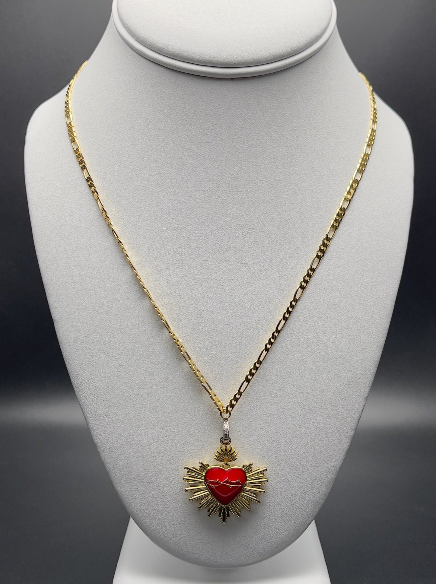 Image of necklace with a red enamel sacred heart pendant.